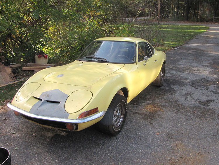 Yellow vintage sports car shipment