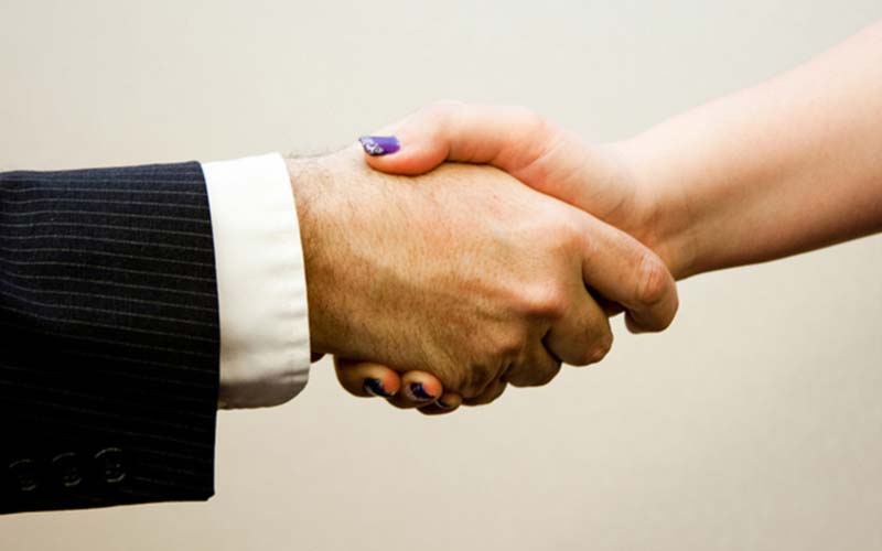 Handshake representing transparent shipping costs